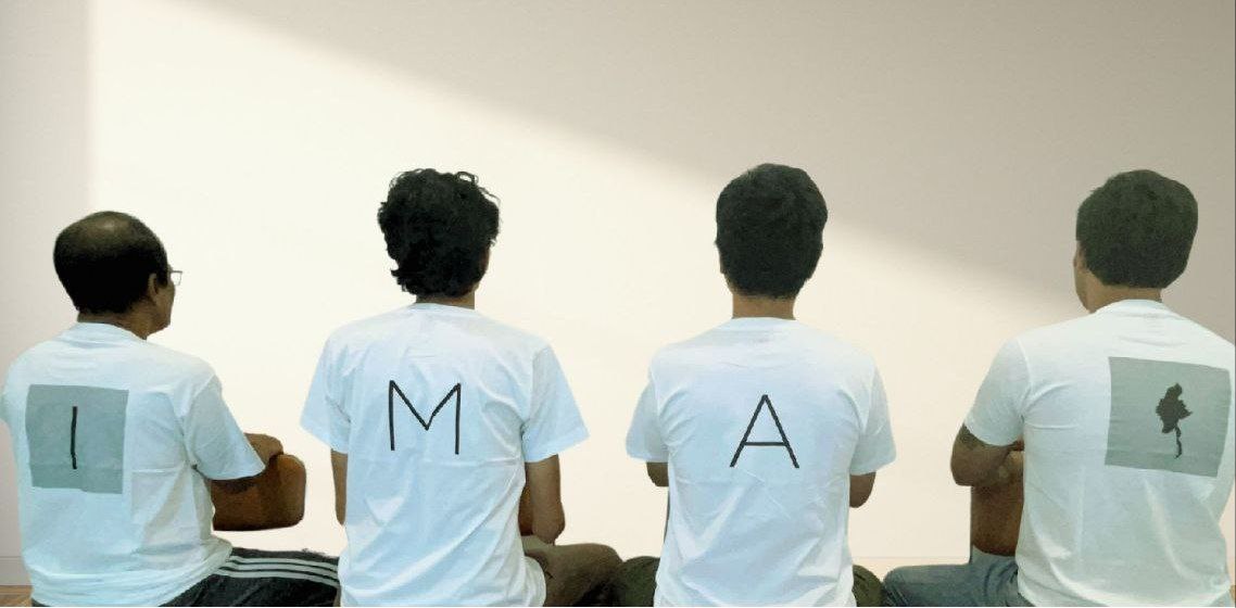 People wearing t-shirts with IMAM letters